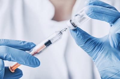 doctor injecting flu vaccine